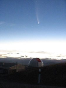 In 2007, I was at the Mount John University Observatory collecting data while Comet McNaught was in the night sky. This was just one of the many shots that I got while walking around the mountain. The dome in seen is for the 1-m McLellan Telescope. (Photo credit: Judy L Mohr)